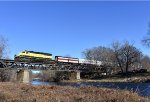 Unit # 3016 leads the train across the bridge with the Erie Lackawanna Baggage Car # 1785 in plain view 